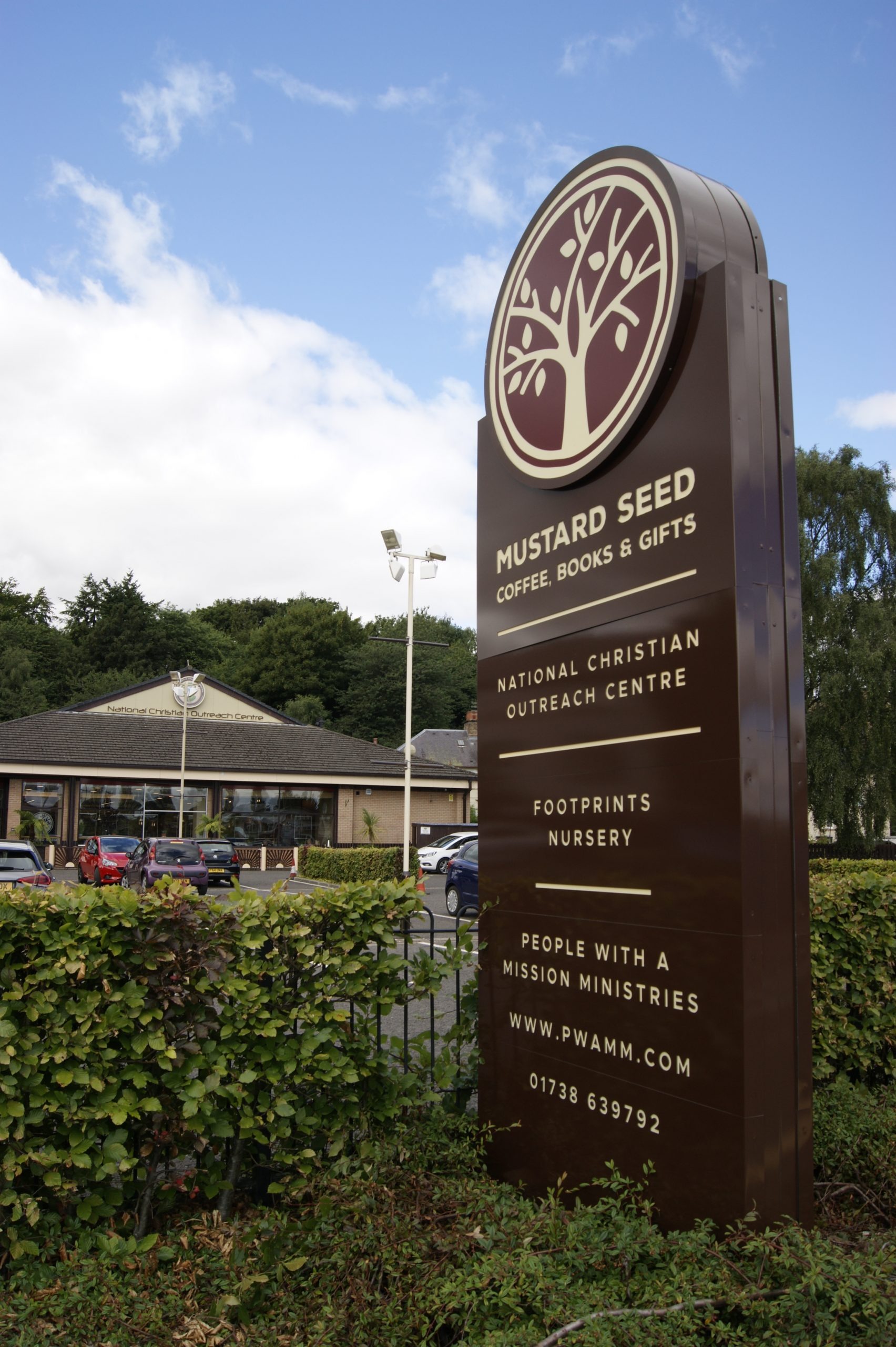Mustard Seed and National Christian Outreach Centre entrance sign in Perth
