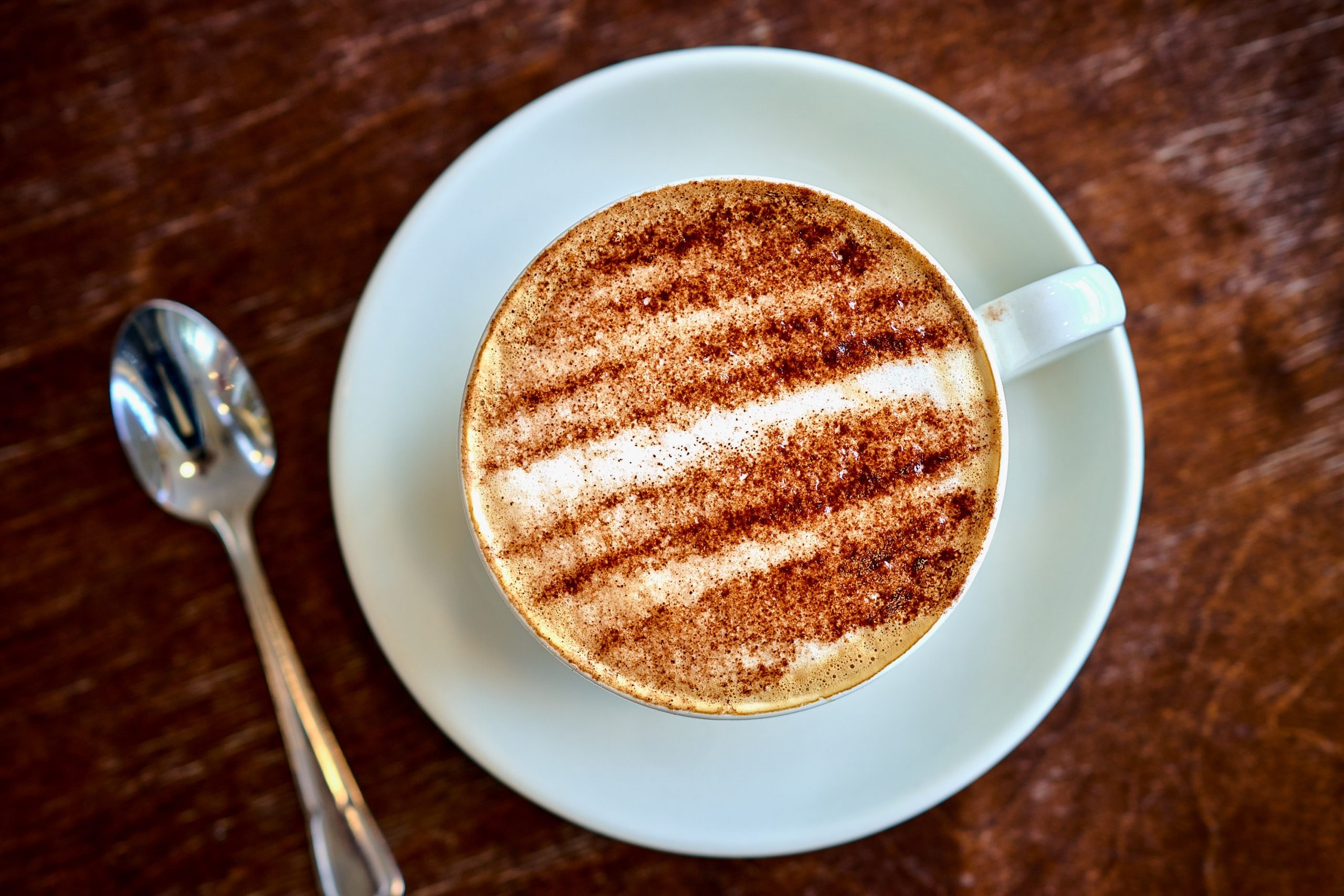 Artisan coffee topped with cinnamon dust